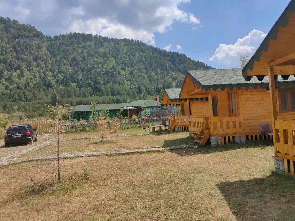 Three wooden cabins in Shalagure farm at southeast Albania 