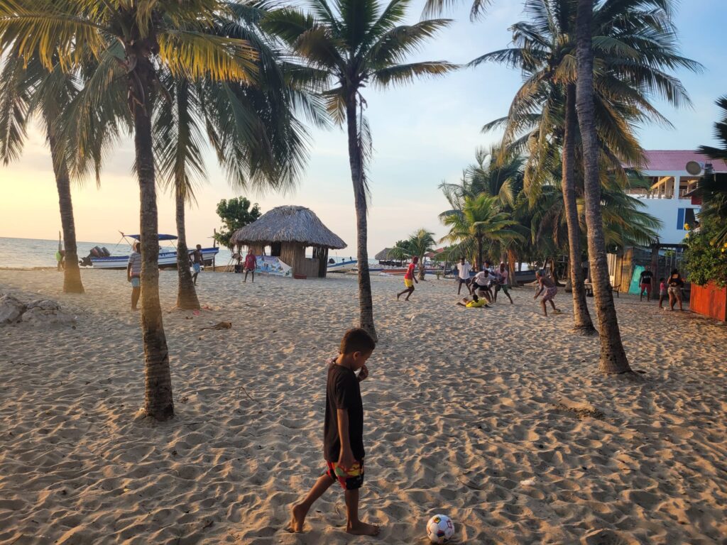 Kids playing football on the beach of Rincon del Mar