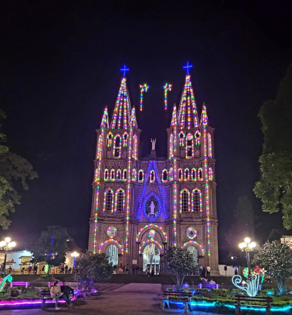 Basilica aglow at nighttime with Christmas lights 