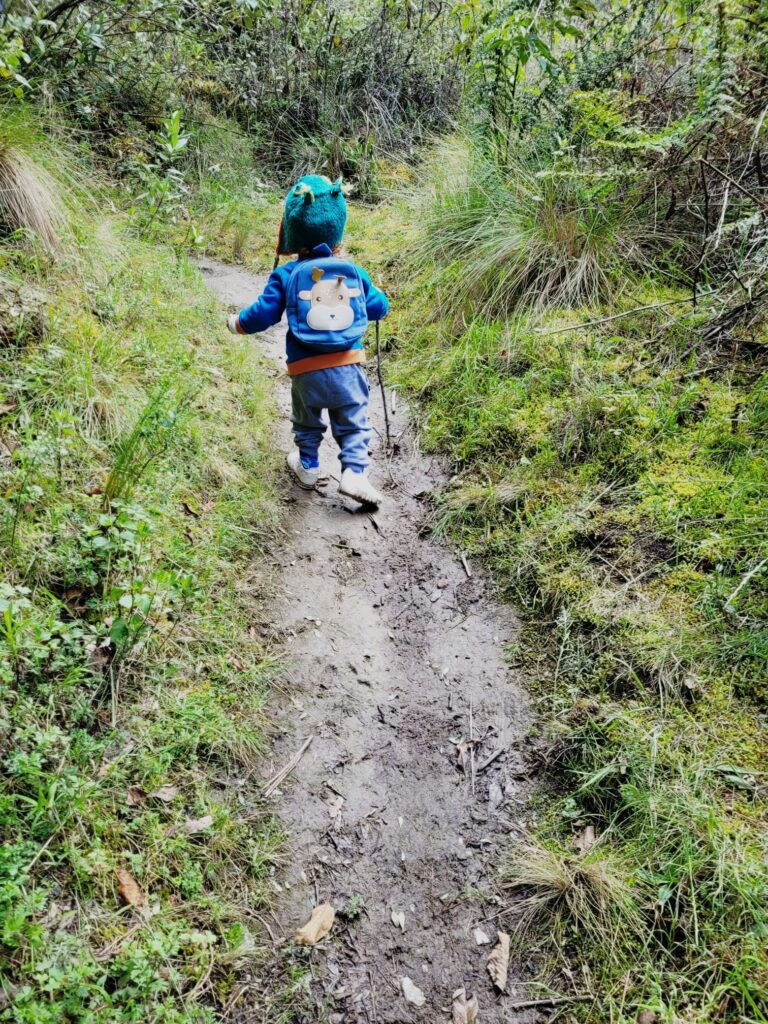 A toddler hiking in Huaraz's mountains 